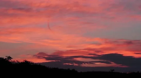Sunrise behind moving clouds timelapse Video stock 43377566