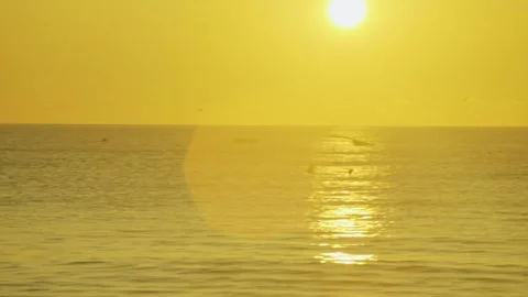 The sunrise behind a shipwreck in the ocean Stock Footage 286102846