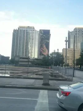 Sunrise Behind Skyscraper Building At Stoplight in Houston Stock Photos