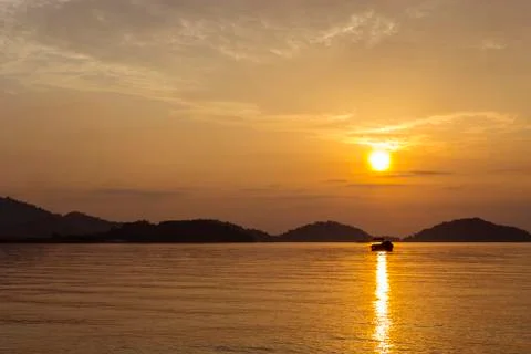 Sunrise with boat Stock Photos