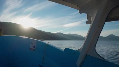 Sunrise from the Boat with a View of the Mountain Range  Stock Footage 293756379