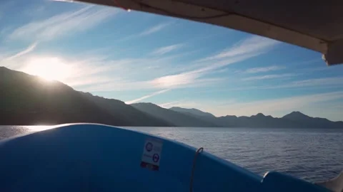 Sunrise on the Boat with a View of the Mountains.  Stock Footage 293756372