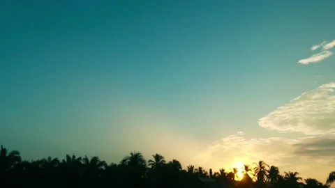 Sunrise with bright sun light ray n sunbeam flare on cyan blue sky Stock Footage 167411305