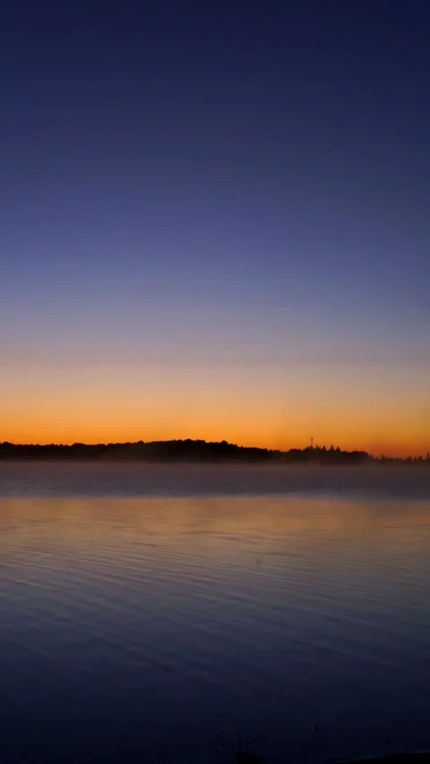 Sunrise on a calm lake Stock Footage 255140788