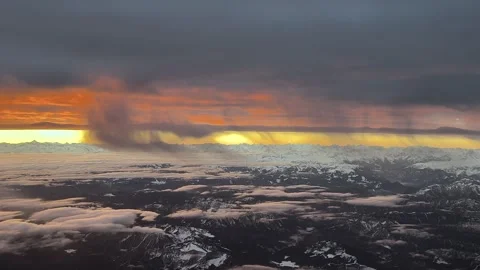 Sunrise Captured From Inside a Jet Cockpit Flying Over the Snowed Alps Mountain Stock Footage 327400144