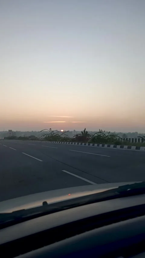 Sunrise captured through the windshield of a car. Stock Footage 300364413