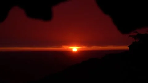 Sunrise from cave while it rains Stock Footage 297792394