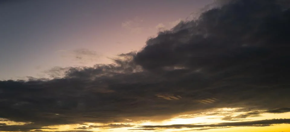 Sunrise Clouds background. Dramatic Clouds Sunset Background. Sky with clouds in Stock Photos