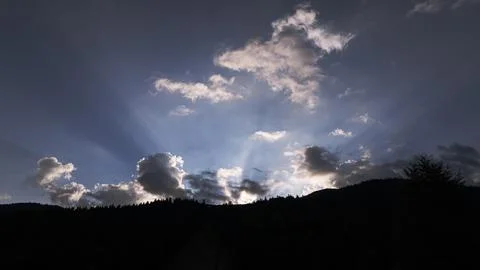 Sunrise in clouds in the mountains 写真素材