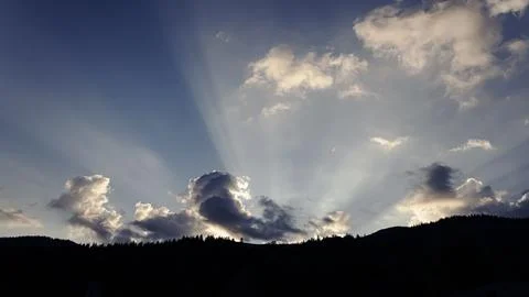 Sunrise in clouds in the mountains Stock Photos