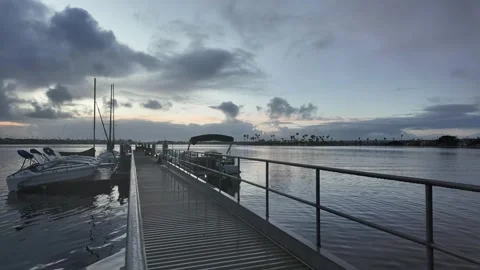Sunrise with clouds over boat dock 스톡 동영상 279050038