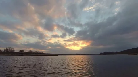 Sunrise with clouds reflection in lake Stock Footage 83906420