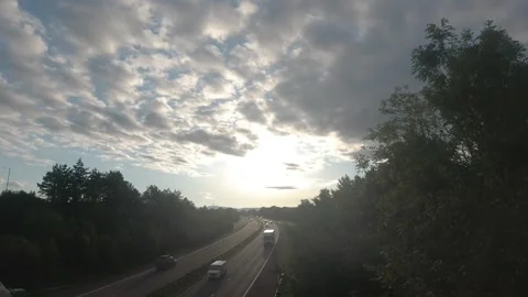 Sunrise Cloudscape Over Busy Motorway Traffic Stock Footage 248199322