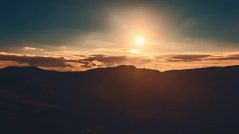 Sunrise cloudscape sky mountain range silhouette Stock Footage 254285282