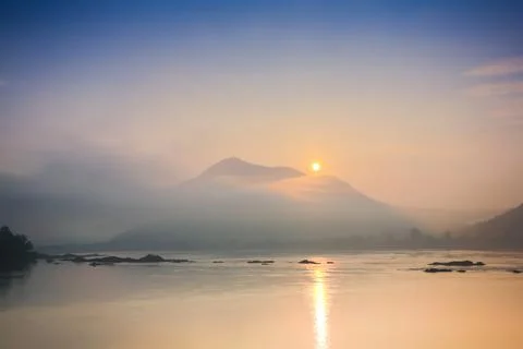 Sunrise cloudy of  landscape view in front of river Stock Photos