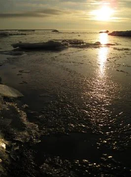 Sunrise at cold sea Stock Photos
