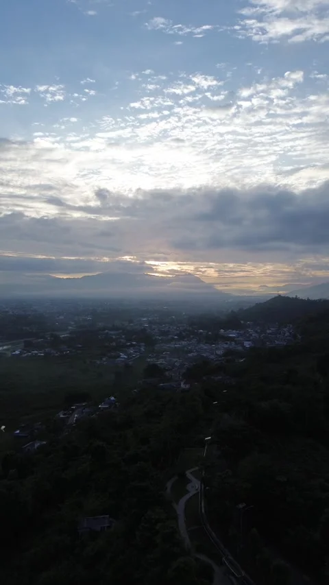Sunrise with dark clouds in the sky over the mountains Stock Footage 271021771