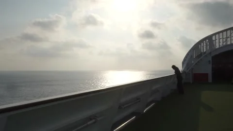 Sunrise from the deck of a ship sailing in the ocean. Stock-Footage 135385729