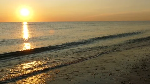 Sunrise at Delaware Bay, Waves, LR pan option to empty pebbled beach, 4K Stock Footage 139018016