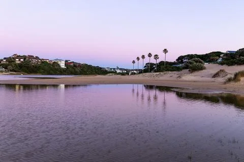 Sunrise on a deserted beach Stock Photos