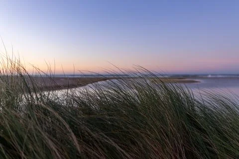 Sunrise on a deserted beach Stock Photos