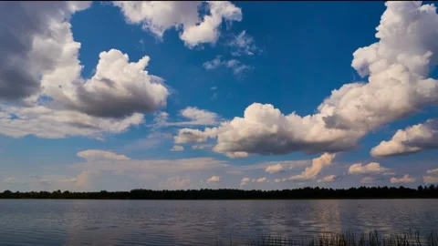 Sunrise with dramatic cloudscape over the sea video. Lake under blue sky. 스톡 동영상 136455100
