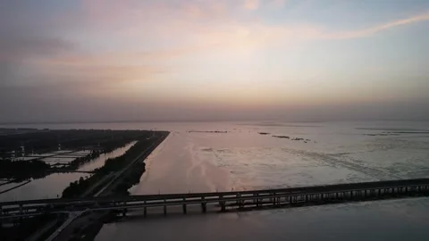 Sunrise drone view of bridge towers and water in China Stock Footage 337675003