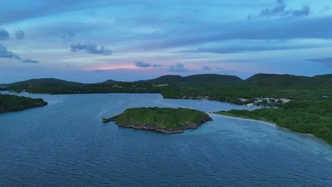 Sunrise drone view of Cap Chevalier islets, Martinique - misty clouds 4K Stock Footage 306953614