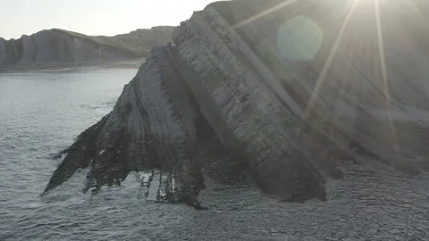 Sunrise drone view of Cliffs and Ocean with sun beams in Spain 4K Stock Footage 137707530