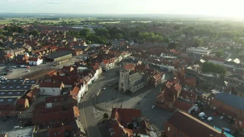 Sunrise drone view over historic church in English market town Stock Footage 221216705