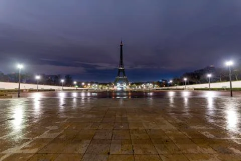 Sunrise on the Eiffel tower reflection on the wet floorof the Trocadero place Stock Photos