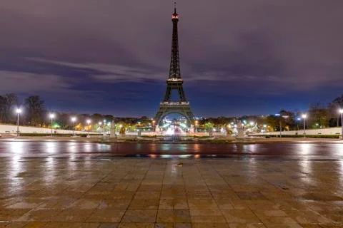 Sunrise on the Eiffel tower reflection on the wet floorof the Trocadero place Stock Photos