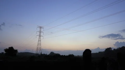 Sunrise with electricity grid in frame Stock Footage