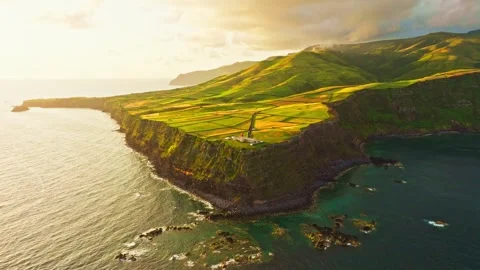 Sunrise at Farol do Albarnaz Lighthouse, Flores Island, Azores. Aerial View Stock Footage 347010666