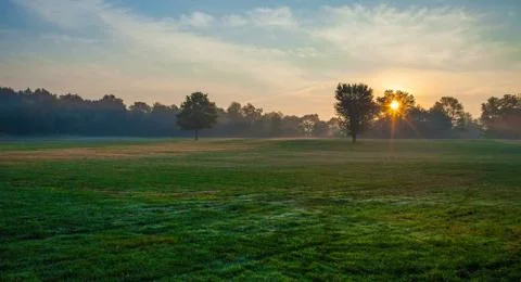 Sunrise in the field Stock Photos