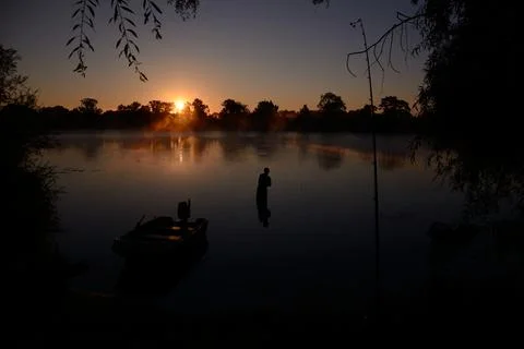 Sunrise fishing Stock Photos