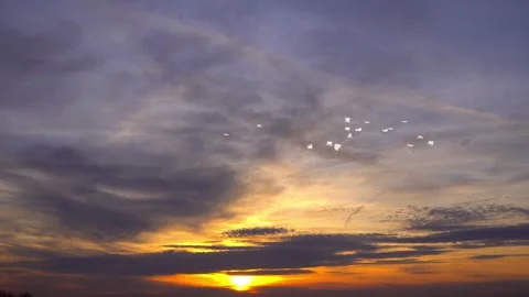 Sunrise Flight Over Orange Clouds Stock Footage 325329425