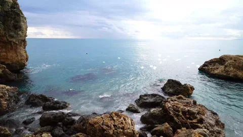 Sunrise Flight Over Rocky Cliffs with Seagulls Stock Footage 325329332