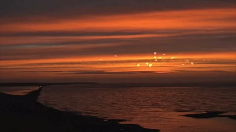 Sunrise Flight: Seagulls Soar Through Crimson Clouds Video stock 325329316