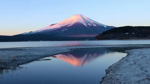 Sunrise at Fuji mountain in winter with reflection of Fujiyama in lake Kawaguchi Stock Footage 286058129