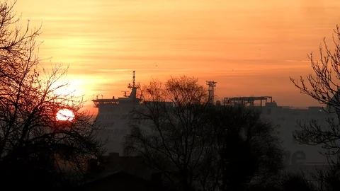 Sunrise Green Flash with flying birds, rotating wind turbines and ship Stock Footage 106333486