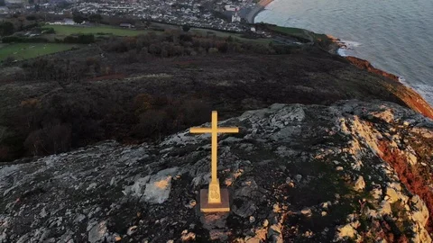Sunrise hill top fly backwards cross reveal Stock Footage 101657596