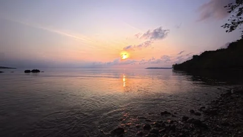 Sunrise on the horizon of a sandy beach on  tropical paradise island in Thailand Stock Footage 332065249