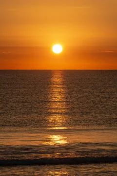 Sunrise on the horizon at sea. Stock Photos