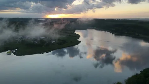 Sunrise hyper lapse over cloudy lake Stock Footage 215490690