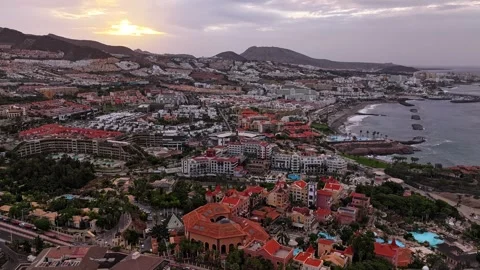 Sunrise hyperlapse above Costa Adeje resort town and Tenerife coastline, 4K Video stock 308987719