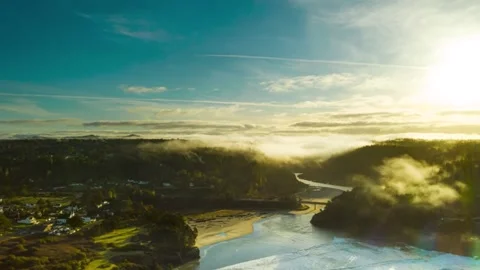 Sunrise Hyperlapse Fog Burning off Forest into Ocean Coastal Town Stock Footage 151358068