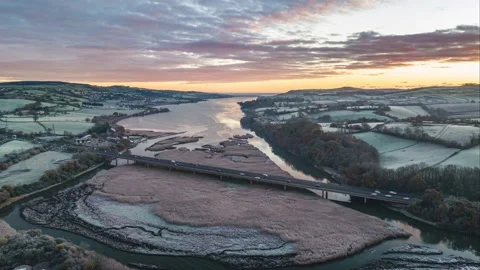 Sunrise in Hyperlapse over Newton Abbot Bridge and Marshland of River Teign 動画素材 224780135