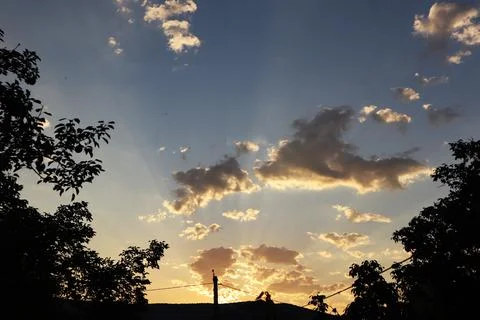 Sunrise, illuminated clouds and rays. Mchadijvari, Georgia Stock Photos