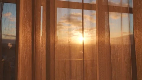 Sunrise illuminates apartment with glowing rooftops and clouds Stock Footage 327804488